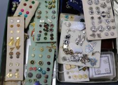 A large collection of pairs of stud earrings, mainly costume, in two boxes.