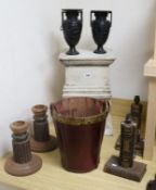 A pair of book ends, leather bucket, two large plinths/stands and a pair of candlesticks