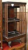 An Edwardian satinwood banded, boxwood and ebony line inlaid mahogany square revolving bookcase,