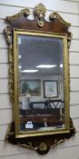 A George III style walnut and parcel gilt fret-cut mirror H.104cm