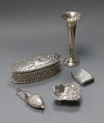 A late Victorian repousse silver trinket box, a silver spill vase, silver salt, silver vesta case