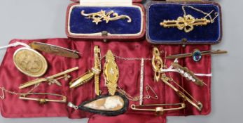 A collection of gold and other bar brooches, a lava cameo brooch and a cameo pendant in jet mount,