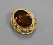 A Victorian yellow metal and citrine set oval brooch, 37mm.