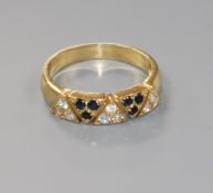 A modern 585 yellow metal and two colour sapphire? cluster half hoop ring, size O.