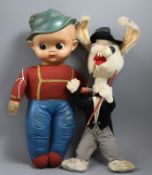 A comic felt rabbit, circa 1950's and a stuffed doll celluloid head, 1950's H.12in. & 15in.