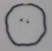 A modern single strand cultured Tahitian pearl necklace with 9ct gold clasp and pair of similar