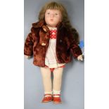 A Käthe Kruse cloth girl doll, c.1955, with synthetic head and plaited brown wig, cloth body and