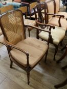 An Edwardian inlaid mahogany open armchair and another carved mahogany open armchair