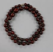 A graduated single strand of simulated cherry amber beads, gross 88 grams, 84cm.
