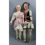 A pair of rare automaton dolls, circa 1840 in original costume from the family of Johann Baptist