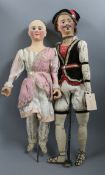 A pair of rare automaton dolls, circa 1840 in original costume from the family of Johann Baptist