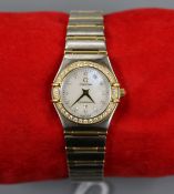 A lady's steel, yellow metal and diamond set Omega Constellation quartz wrist watch, with Omega