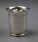 A late 19th/early 20th century French 950 white metal beaker, on beaded foot, 3.5 oz, 75mm.