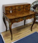 A 19th century French gilt metal mounted figured walnut bonheur du jour W.92cm