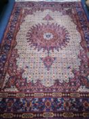 A Tabriz ground carpet 294 x 197cm