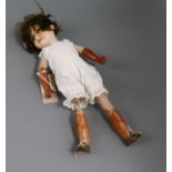An Armand Marseille 390 open mouthed bisque headed doll, with overpainted body and a small