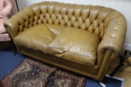 A small buttoned leather Chesterfield sofa W.150cm
