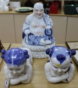 A Chinese blue and white Buddha on stand together with two porcelain kneeling children Buddha 44cm
