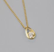 A modern 18ct gold and solitaire diamond pendant, on an 18ct fine link chain, pendant 10mm.