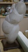 An abstract figural white marble carving, mother with child 58cm high