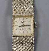 A lady's 9ct white gold Rotary manual wind wrist watch on integral 9ct white gold bracelet.