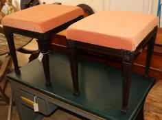 A pair of mahogany stools