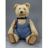 A small 1920s Steiff blonde mohair teddy bear with squeeze box, with glass eyes brown stitched