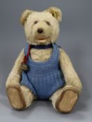 A small 1920s Steiff blonde mohair teddy bear with squeeze box, with glass eyes brown stitched