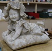 A carved alabaster figure of a baby by Emilio Fiaschi 1858-1941 48cm high x 56cm wide