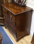 A George III mahogany chest of drawers fitted brushing slide W.79cm