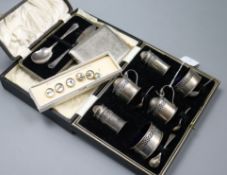 A cased silver six piece condiment set, silver butter knife, silver spoon, guinness buttons and a