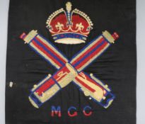 Three albums of WWI/WWII and later cap badges and uniform insignia, many relating to the Machine Gun