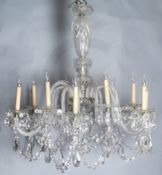 An ornate twelve light cut glass chandelier, with spiral fluted branches hung with beaded swags