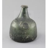 An olive green transitional onion / mallet shaped wine bottle, sealed J. Kennan 1725, height 15cm,