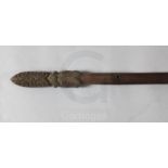 A Maori carved hardwood taiaha staff, New Zealand, with Janus tiki and tapered elliptical shaft,