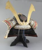 Japanese movie interest: A model of a Japanese Samurai helmet (Kabuto), with ebonised box, helmet