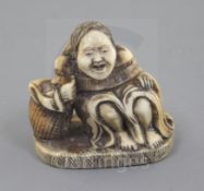 A Japanese ivory netsuke of Shojo, Meiji period, signed Ryumin, seated, resting on a barrel, h. 3.