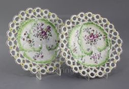 A pair of Derby leaf moulded 'spectacle' plates, c.1758, each painted in 'Cotton-Stem' style with