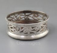 A modern George III style pierced silver wine coaster by Rodney C. Pettit, with engraved decoration,