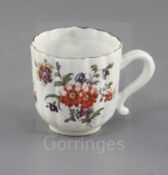 A Derby ribbed coffee cup, c.1758, with unusual S-scroll handle, painted in 'Cotton-stem painter'