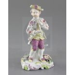 A Derby 'Pale Family' figure of a piper, c.1758, wearing a flower painted jacket and holding a pipe,