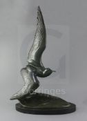 Irénée Rochard (1906-1984). A French Art Deco green patinated bronze model of a seagull flying