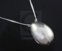 An Astrid Fog for Georg Jensen sterling silver egg shaped pendant necklace, no. 122, pendant 52mm.