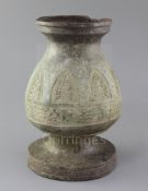 A Chinese archaic bronze ritual vessel, Eastern Zhou/Warring States, of pear shape, cast in relief