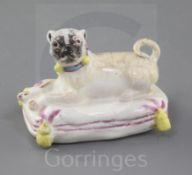 An extremely rare Derby or Girl-on-a-Horse factory figure of a pug, c.1755, recumbent on a pink