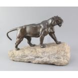 Pierre Granet (1843-1910). A French Art Deco bronze model of a tiger, upon a naturalistic rock base,