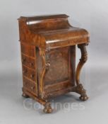 A Victorian figured walnut Davenport, with jack-in-a-box stationery compartment and maple lined