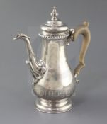 A modern George II style coffee pot by Rodney C. Pettit, of baluster form, with leaf capped spout