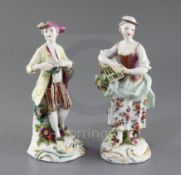 A pair of Derby figures of Liberty and Matrimony, c.1760, each standing by a flowering tree stump,