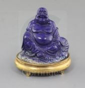 A Chinese lapis lazuli figure of Budai, 18th century, with gilt bronze fitted stand, total height